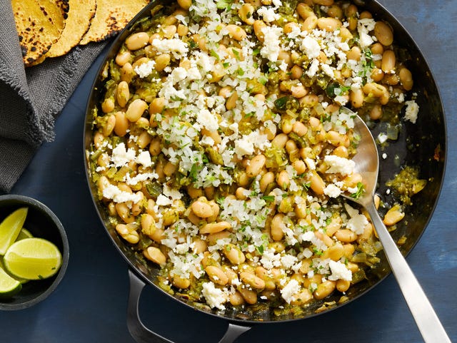 salsa verde beans salsa verde beans in a carbon steel skillet with charred tortillas and lime wedges