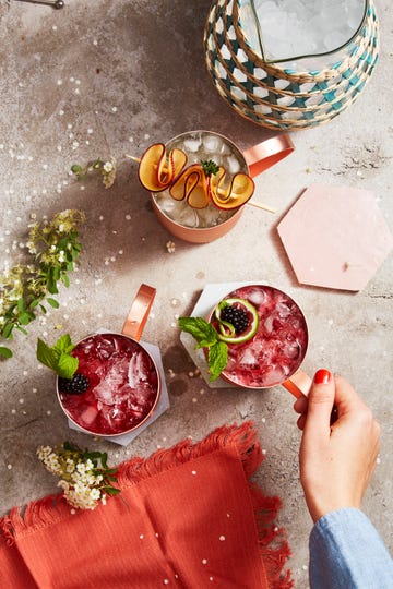 blackberry mint mule in a copper mug