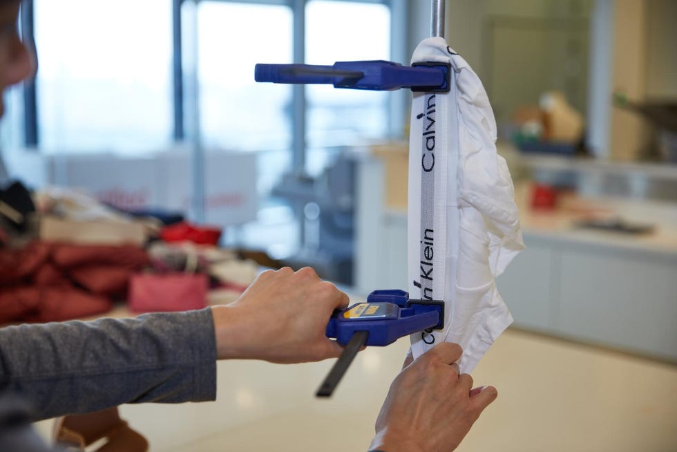 a good housekeeping analyst clamping a pair of underwear for stretch recovery testing