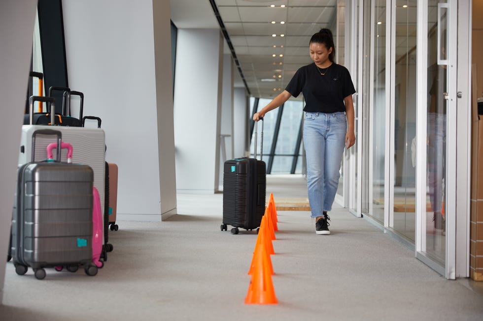 a person pulling a suitcase