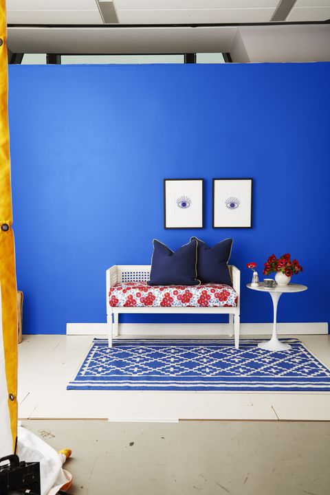 blue room with rattan bench