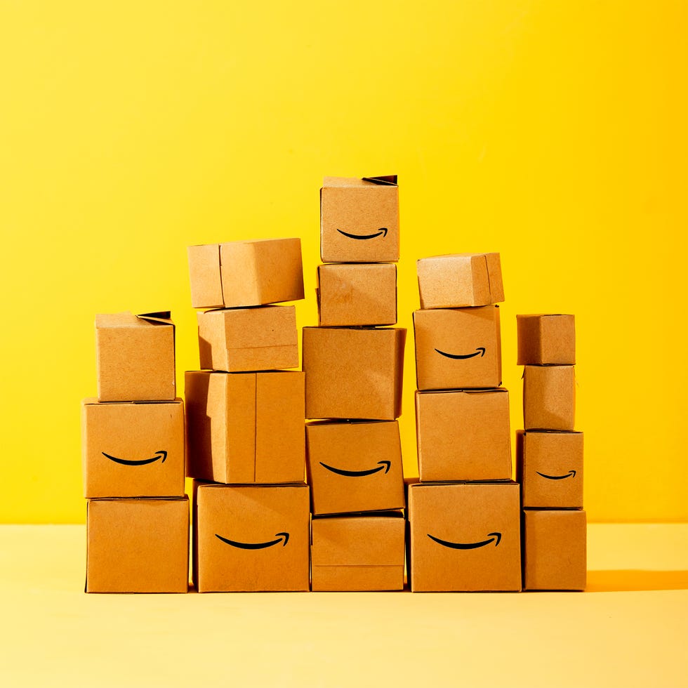stacks of amazon boxes on yellow background