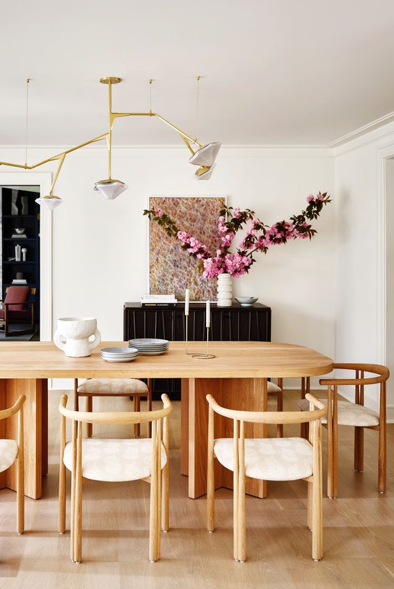 dining room, asymmetric lighting, chandelier from gabriel scott, wood dining table a dreamy retreat modern colors and cool decor in a charming east hampton bungalow home designer ryann swan