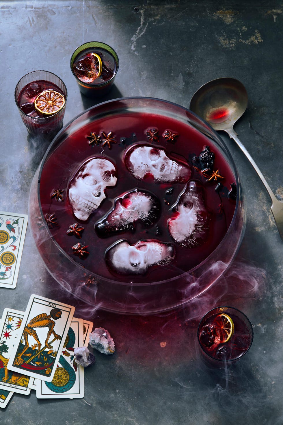 hibiscus halloween punch in glasses garnished with dehydrated lime wheels