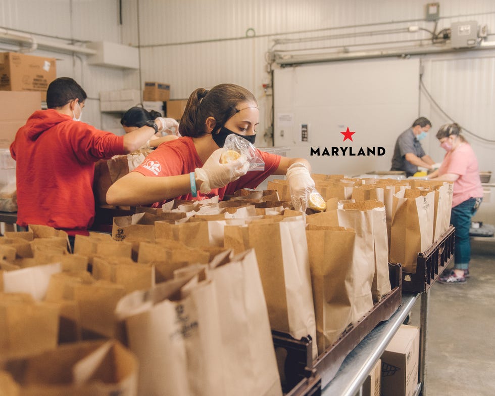 a volunteer packs a bag lunch for the maryland food bank’s grab and go program for students in june, the food bank delivered more than 66,500 of these meals to kids at 20 sites across the state