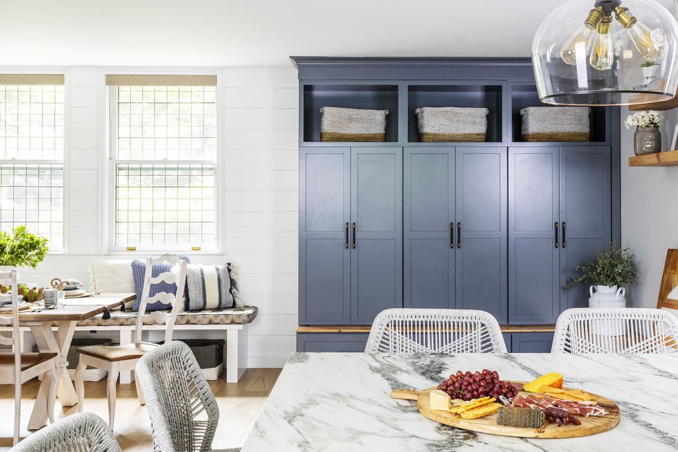 home featuring warm neutrals and soothing blue hues to accent the beautiful architecture of the vintage home interior designer karen b wolf mudroom in kitchen corner