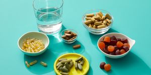 assorted multivitamins on a turquoise background