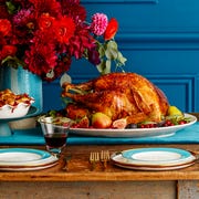 thanksgiving turkey on table thanksgiving turkey and pie on the dinner table with a bouquet of flowers