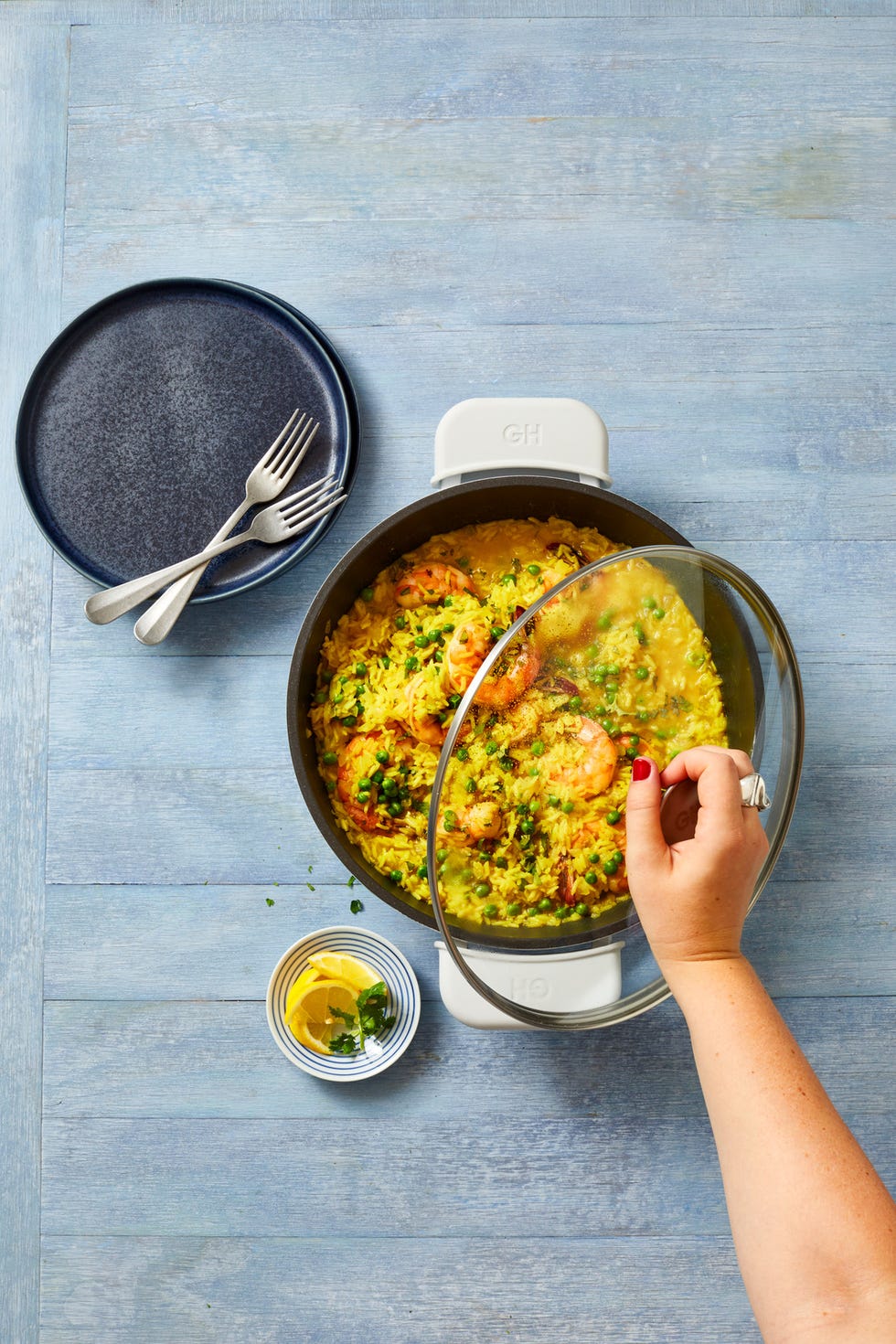 curried rice with shrimp and peas in a pot