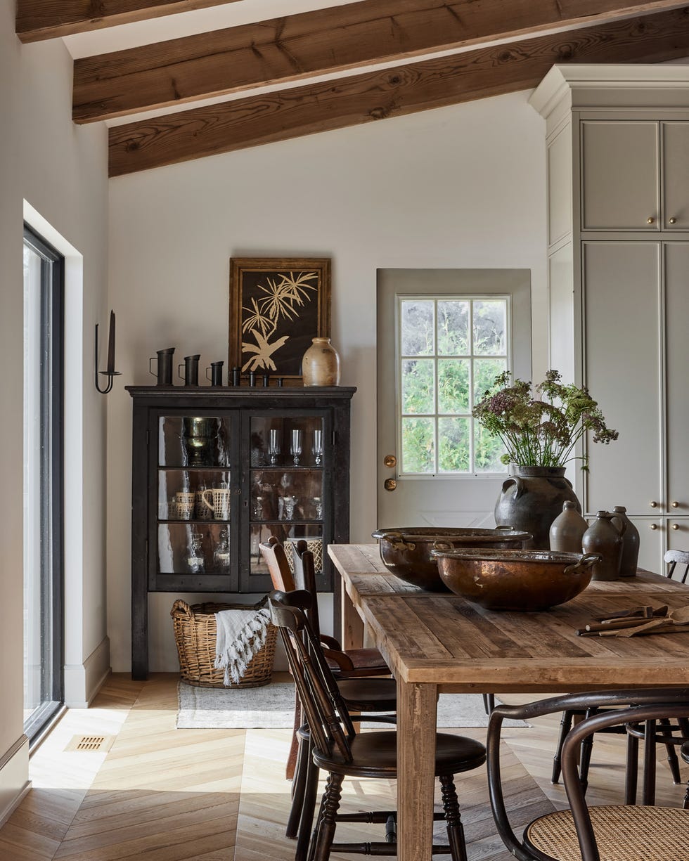 neutral colored dining room with antique furniture