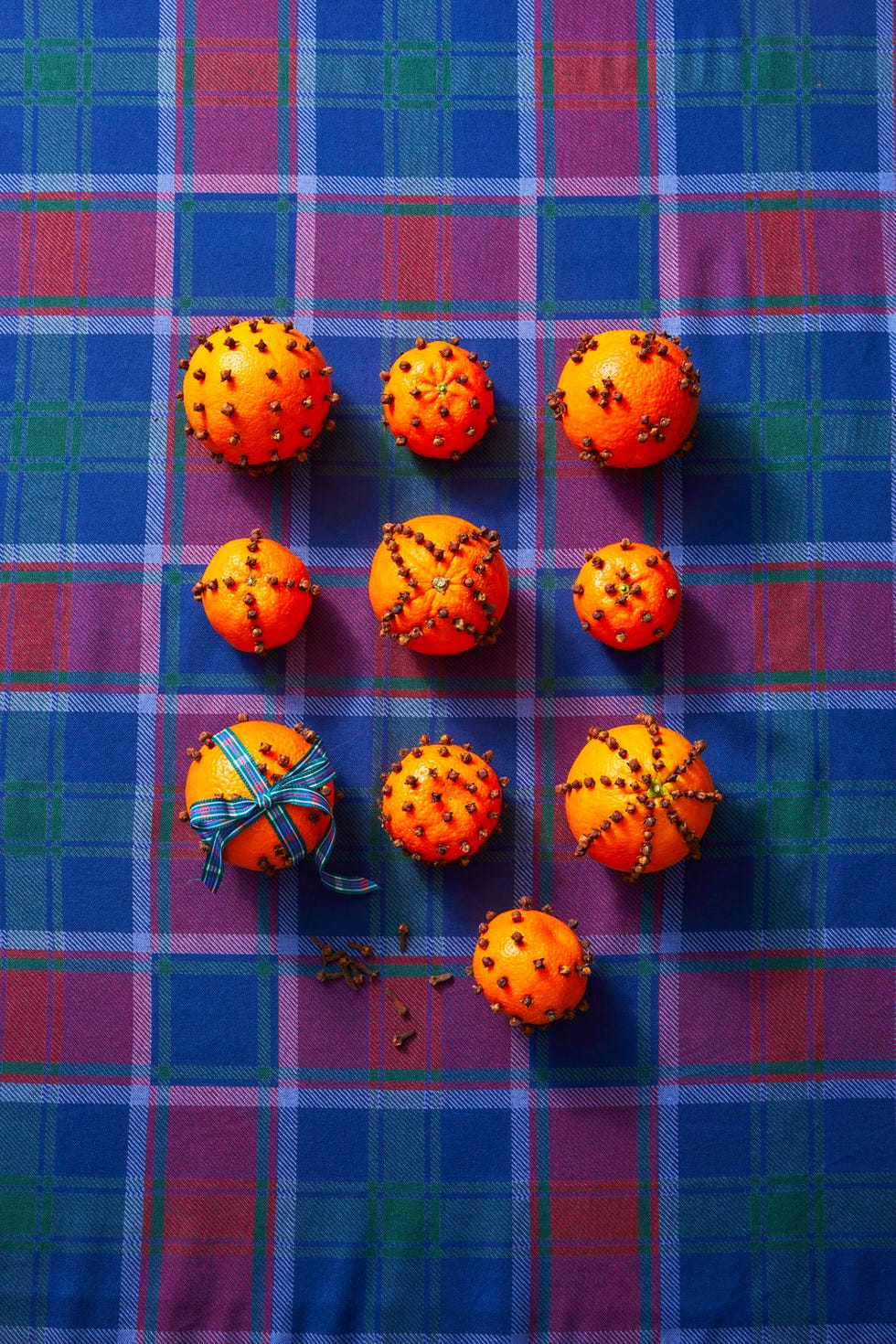 orange decor on plaid tablecloth