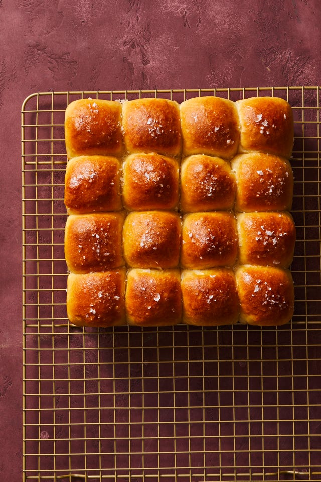 honey butter parker house rolls on a wire rack