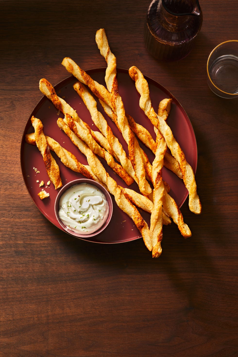 cajun spiced puff pastry straws with a dip on the side