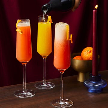Winter Citrus Mimosas pink grapefruit, tangerine, and blood orange mimosas in champagne flutes