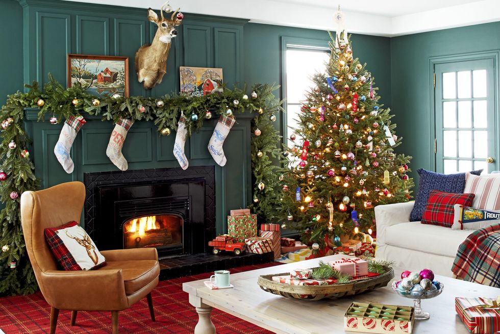 living room with christmas tree and holiday decorations