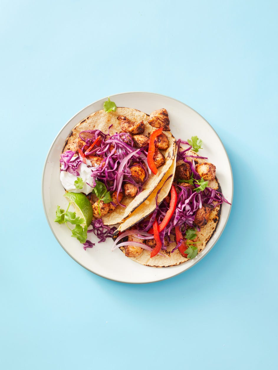 chicken mole tacos with shredded purple cabbage on top