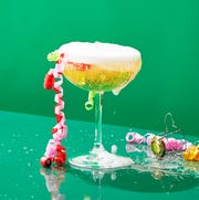champagne in a coupe champagne in a coupe overflowing with festive ribbons dangling