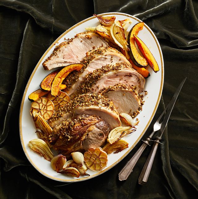 fennel crusted roast pork with acorn squash on a white plate