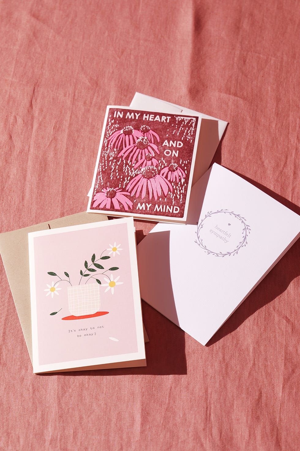 sympathy cards on pink fabric sheet