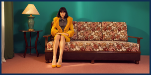 Yellow, Couch, Sitting, Furniture, Leg, Fashion, Room, Leisure, Photography, Black hair, 