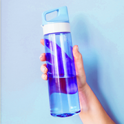 woman holding water bottle