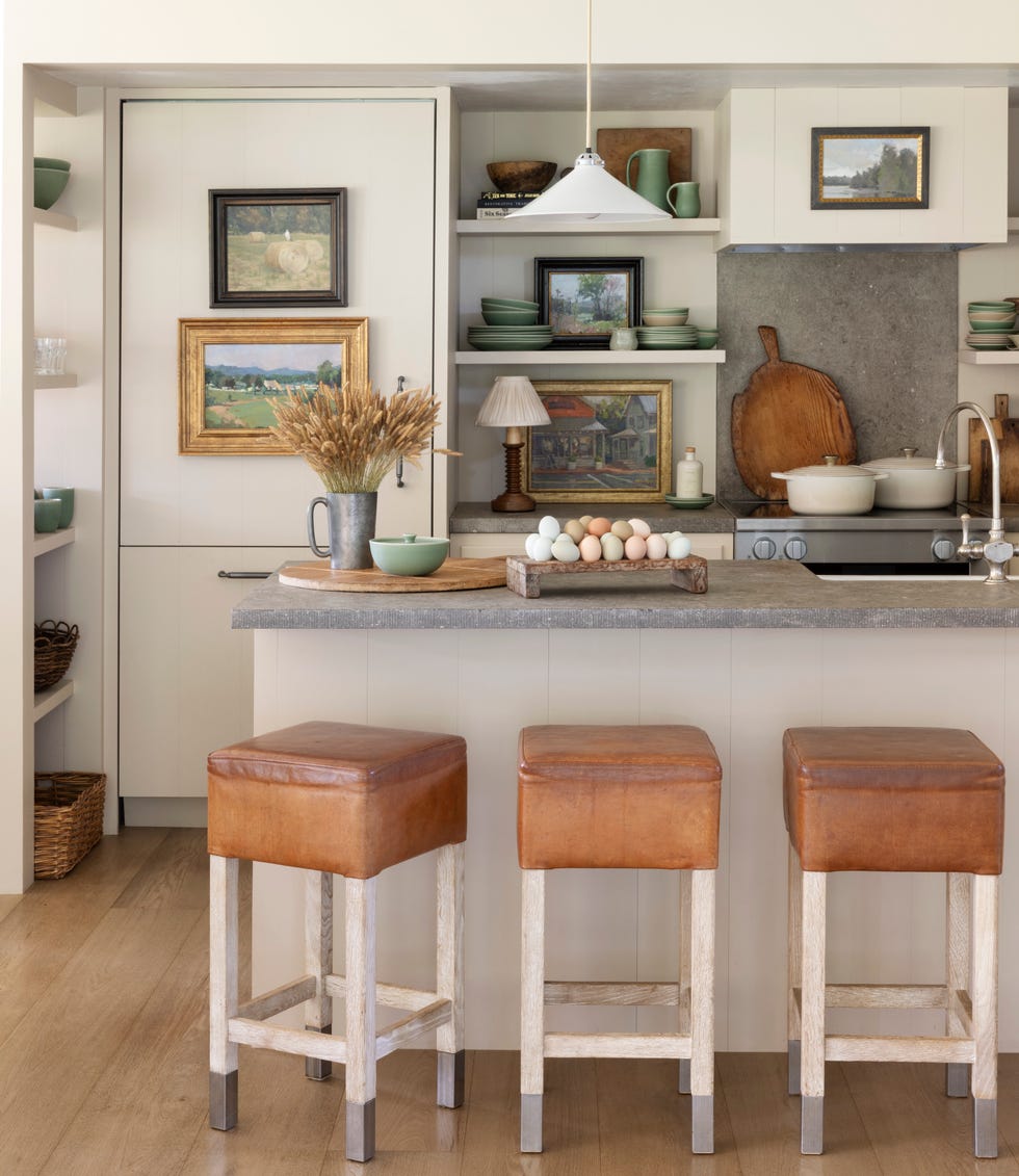 kitchen with cream painted cabinetry and leather stools