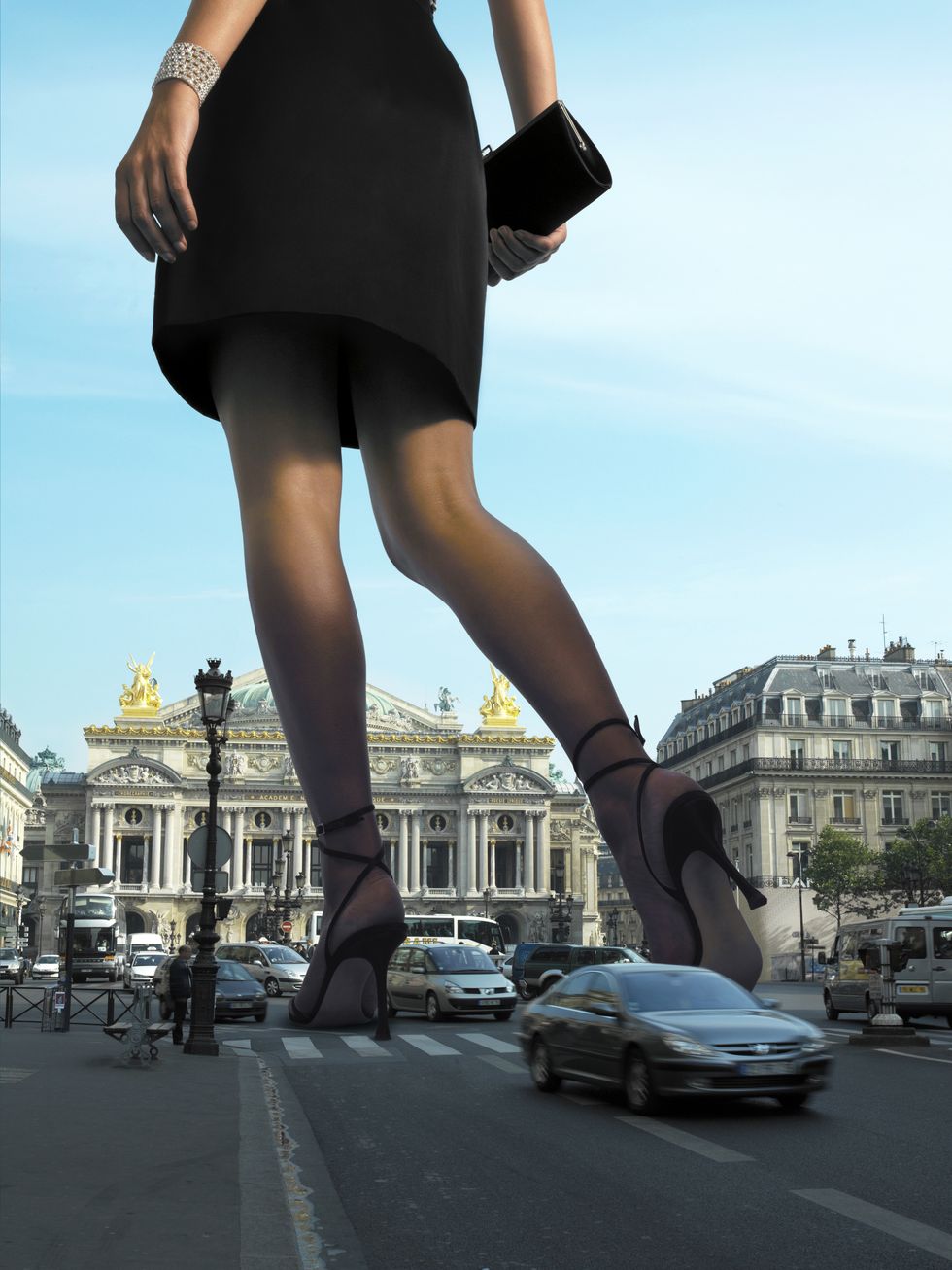 giant woman crossing busy road, low section digital composite