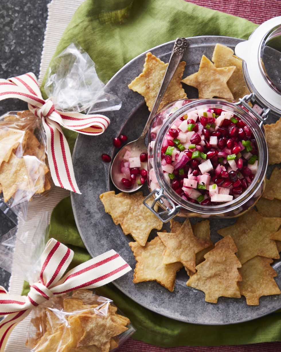 a jar of holiday salsa and plastic gift bags of festive tortilla chips in the shapes of trees and stars