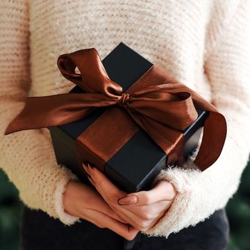 gift box in female hands new year christmas gift