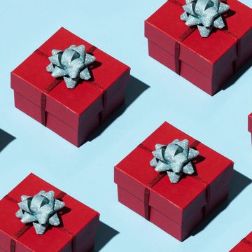 multiple red gift boxes with blue bows