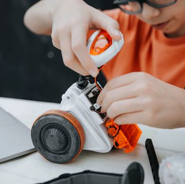 boy playing with robot toy