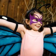 This is an image young girl in butterfly costume