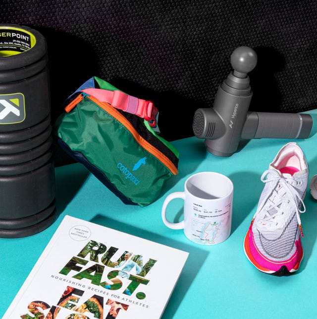 foam roller, fanny pack, bucket hat, running shoes, head lamp, strava mug, run fast eat slow book