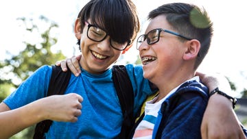 two tween boys laughing