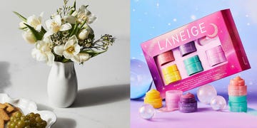 white vase with flowers next to a laneige lip set