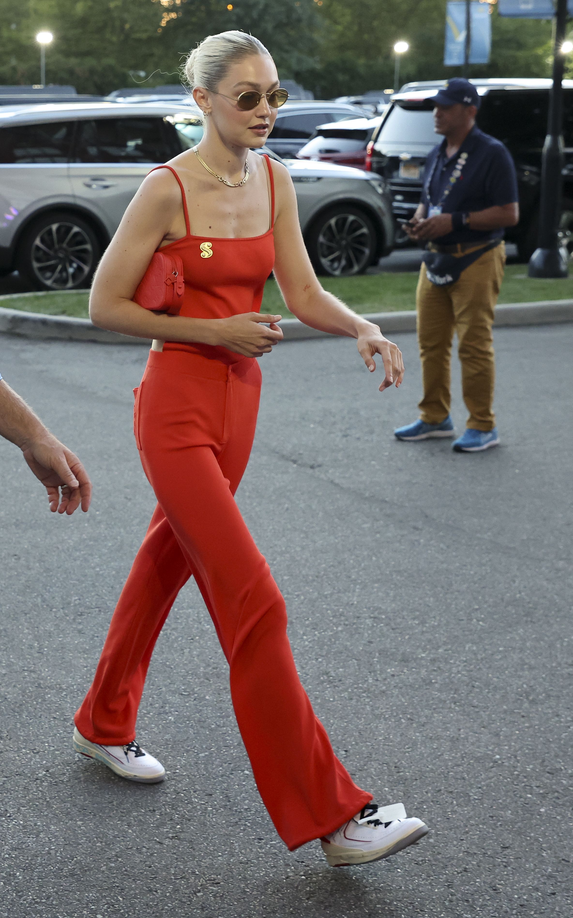 Gigi Hadid wears a red backless jumpsuit