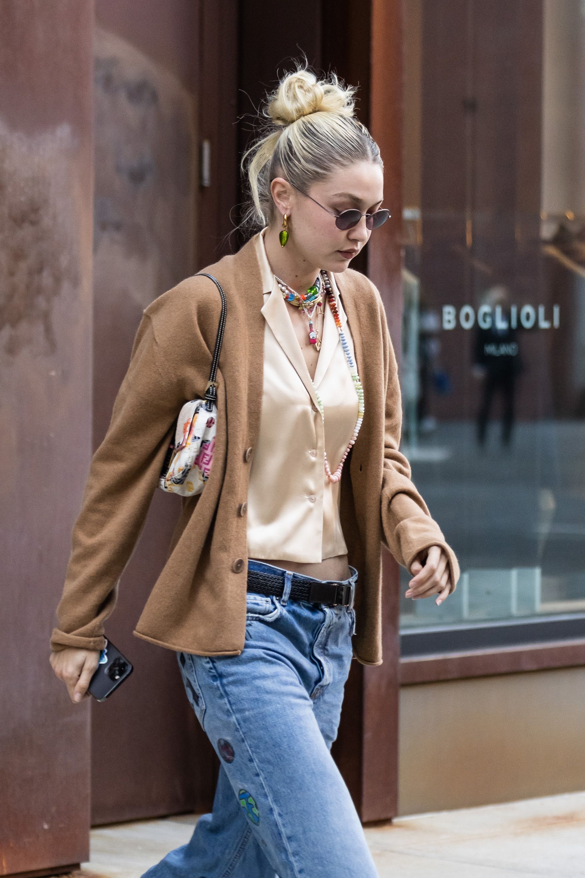 Gigi Hadid Wears a Cream-Colored Knit Top and Matching Trousers