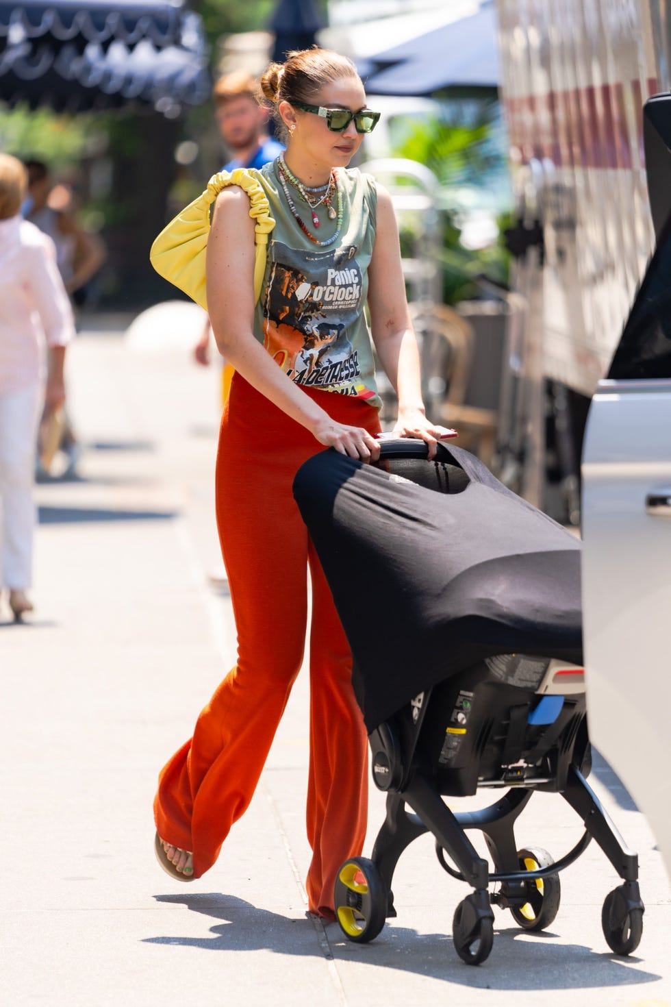 Gigi Hadid Wears a Cream-Colored Knit Top and Matching Trousers