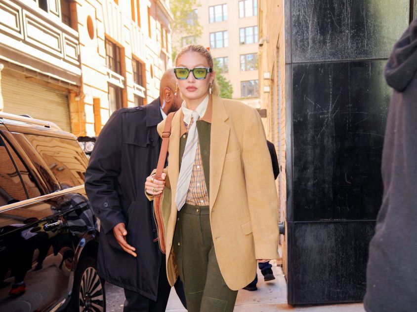 Gigi Hadid in beige trench coat and sweatpants in NYC on April 27 ~ I want  her style - What celebrities wore and where to buy it. Celebrity Style