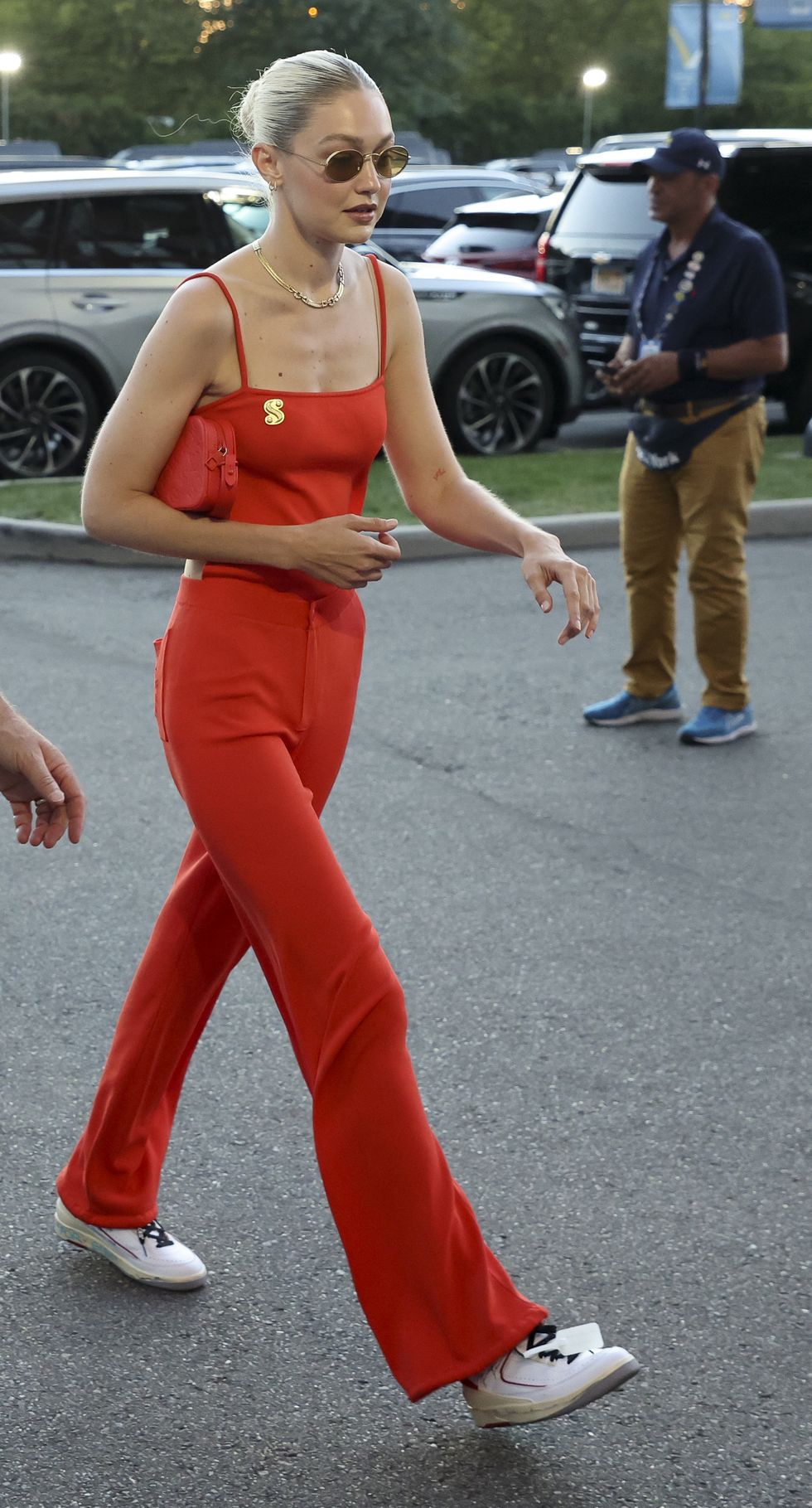 Gigi Hadid wears a red backless jumpsuit