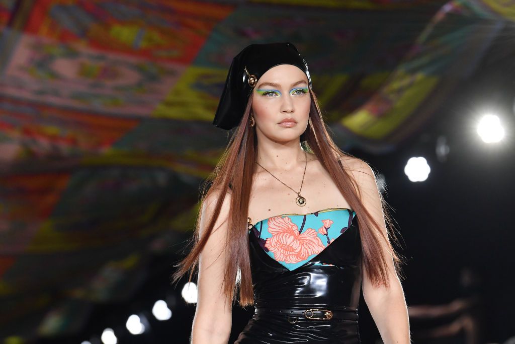 Gigi Hadid transforms into a glam disco goddess in sequined gown and tight  blonde curls, plus more celebs during New York Fashion Week 2022, Gallery