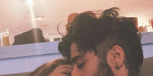 an instagram of zayn and gigi kissing