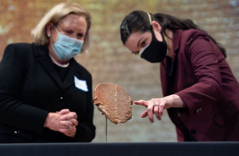 patty gerstenblith l, a professor at depaul university, and katharyn hanson r, a cultural heritage preservation scholar at the smithsonian institute, look at the gilgamesh tablet, a 3,500 year old mesopotamian cuneiform clay tablet that was believed to be looted from iraq around 1991 and illegally imported into the us to be displayed at the washington museum of the bible, during a ceremony to repatriate the tablet to iraq, at the smithsonian national museum of the american indian, in washington, dc, september 23, 2021   unesco called the repatriation of the tablet, along with 17,000 other artifacts sent back to iraq in july, "a significant victory in the fight against the illicit trafficking of cultural objects" photo by saul loeb  afp photo by saul loebafp via getty images