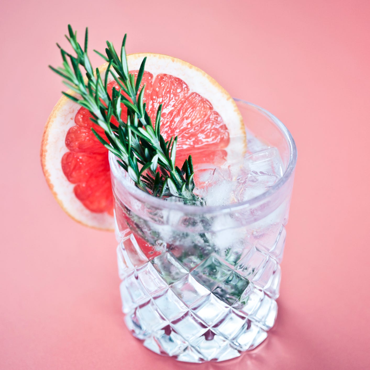 gin and tonic with a slice of pink grapefruit