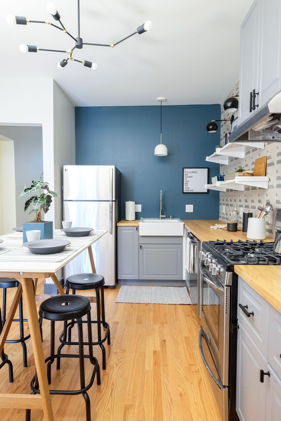 grey ikea kitchen cabinets with blue wall