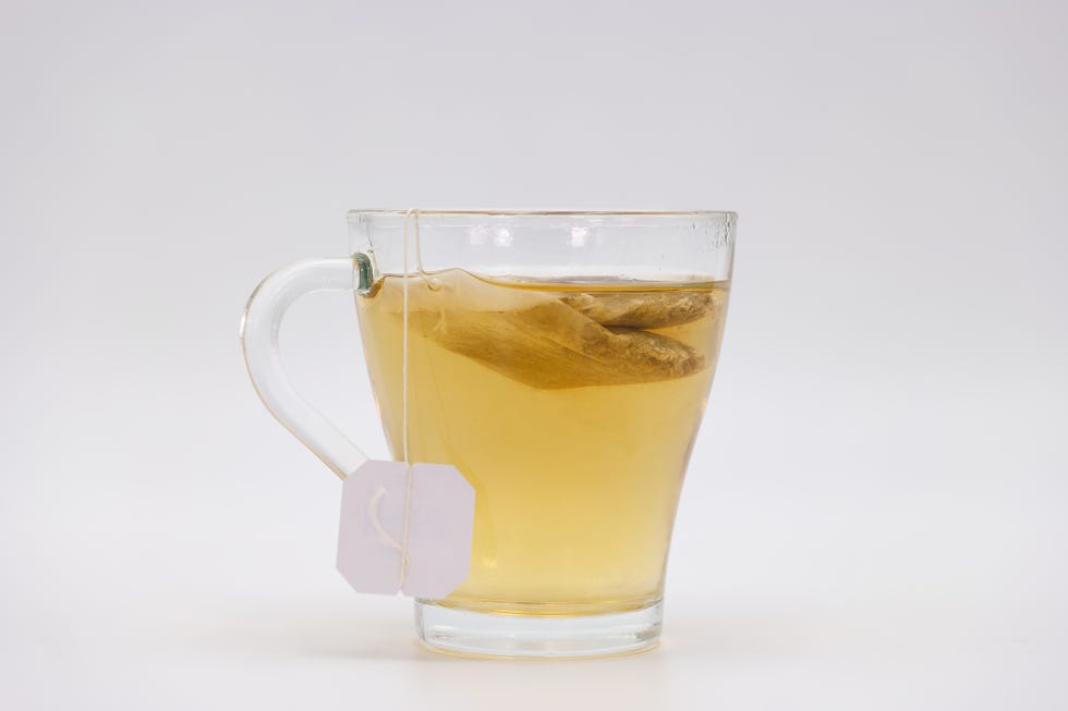 clear glass mug of ginger tea