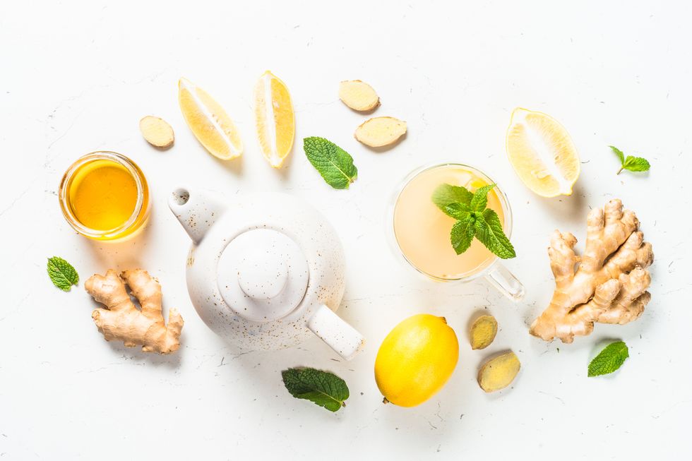 ginger tea with lemon at white table