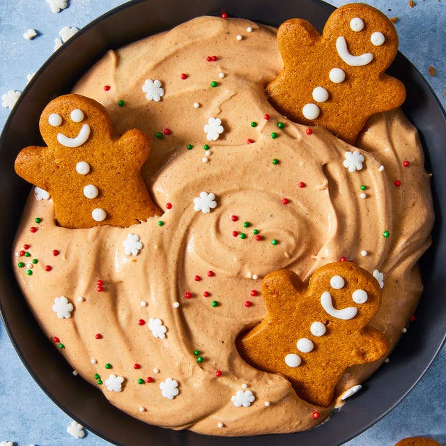 Gingerbread Cheesecake Dip gingerbread flavored cheesecake dip in a bowl topped with sprinkles and gingerbread cookeis