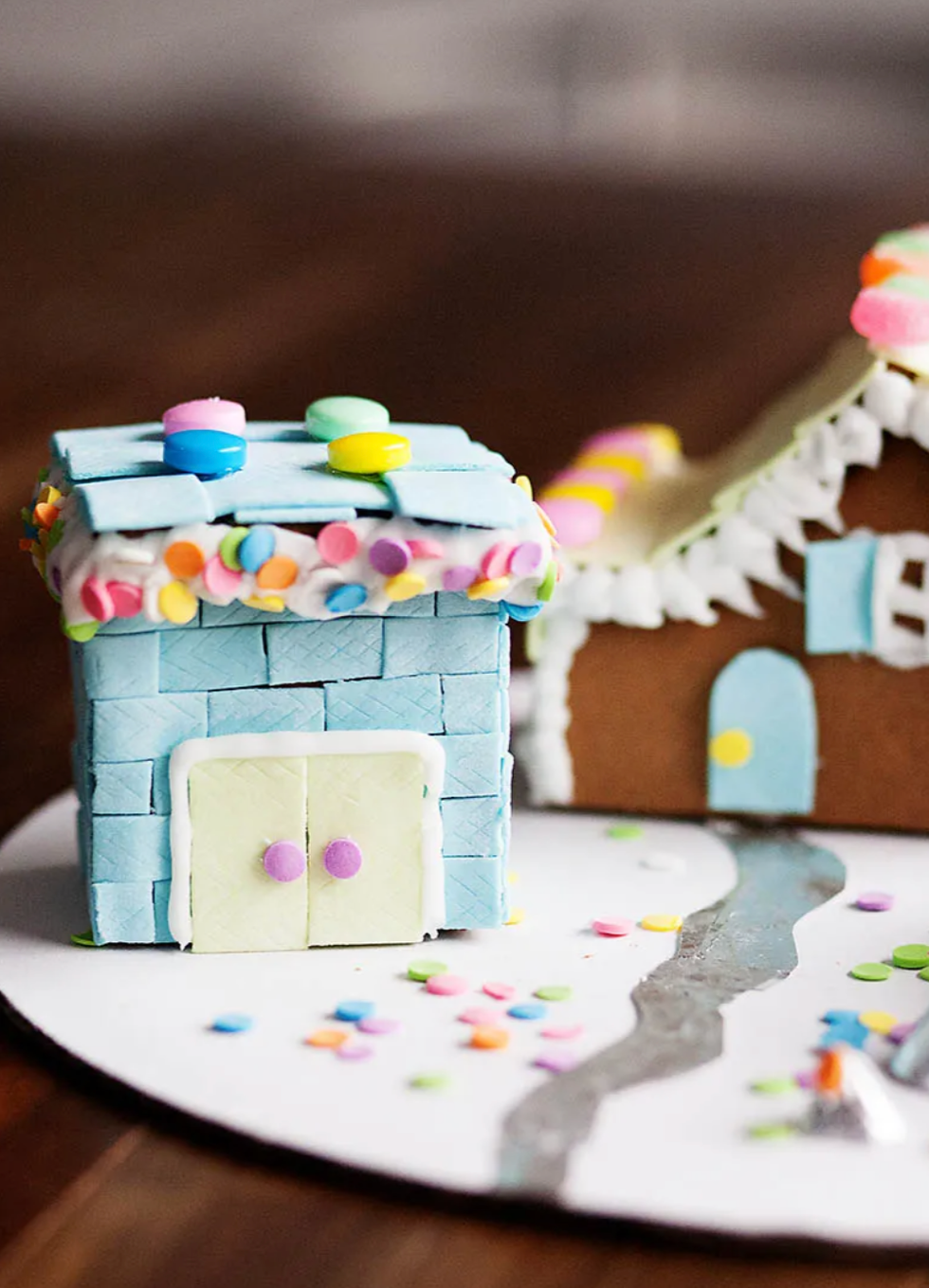 gingerbread house covered with slices of gum and candy