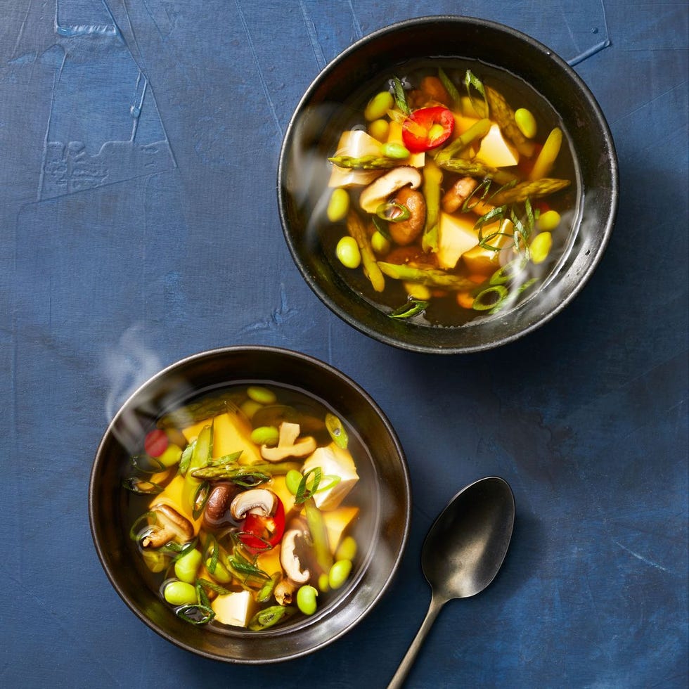 gingery spring soup with edamame and mushroom in a bowl